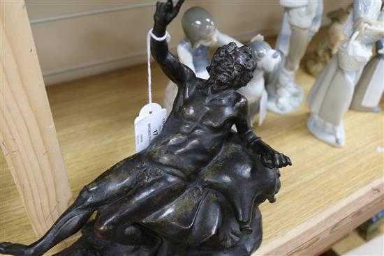 A bronze of a reclining man height 24cm